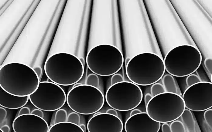 Industrial extruded aluminium pipes and round tubing stacked at HAQ Aluminium plant